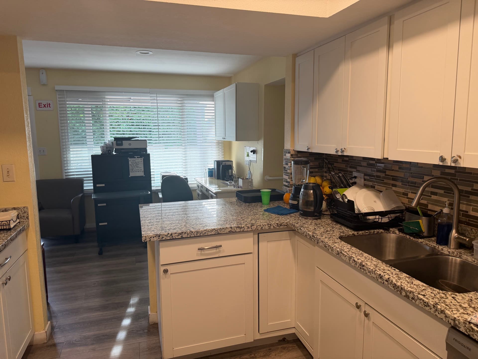Updated kitchen with granite counters where home-cooked meals are prepared